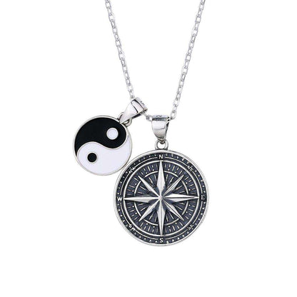 Compass-themed necklace featuring "Only Way is Forward." Spanish translation on the back.